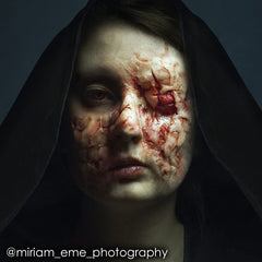 Prosthetic adhesion with Mehron Spirit Gum on the face during FX makeup