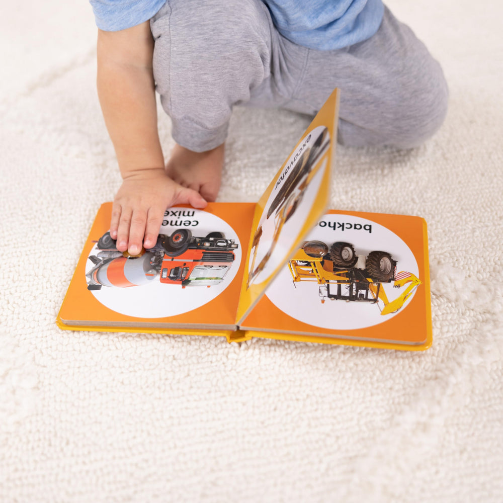 Melissa & Doug Poke-a-Dot Construction Vehicles pages show bright excavator image for vocab growth