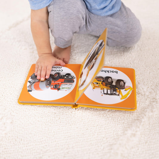 Melissa & Doug Poke-a-Dot Construction Vehicles pages show bright excavator image for vocab growth