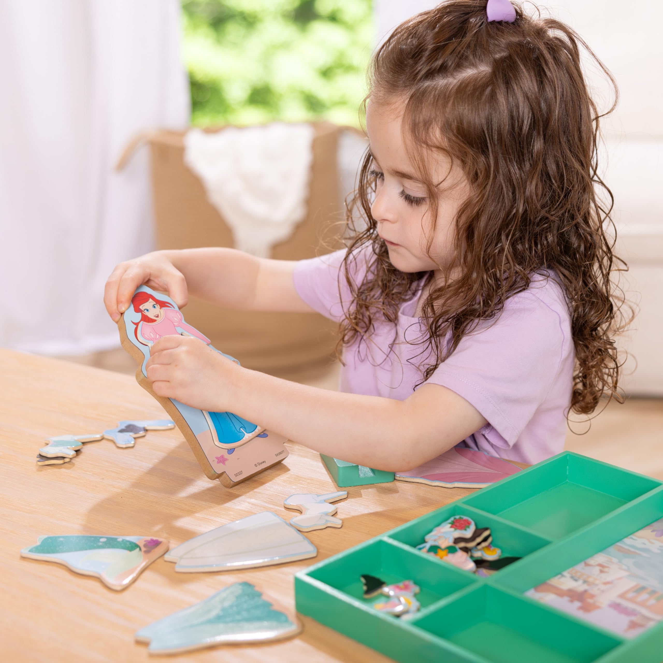 Close-up of Ariel dress-up pieces with chunky magnets for little hands