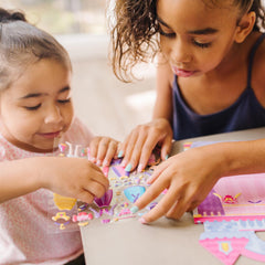 Melissa and Doug ball gown stickers invite colorful wardrobe makeovers for creative dress-up fun.