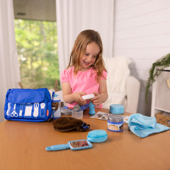 Zippered shaving bag keeps all pieces organized after play.