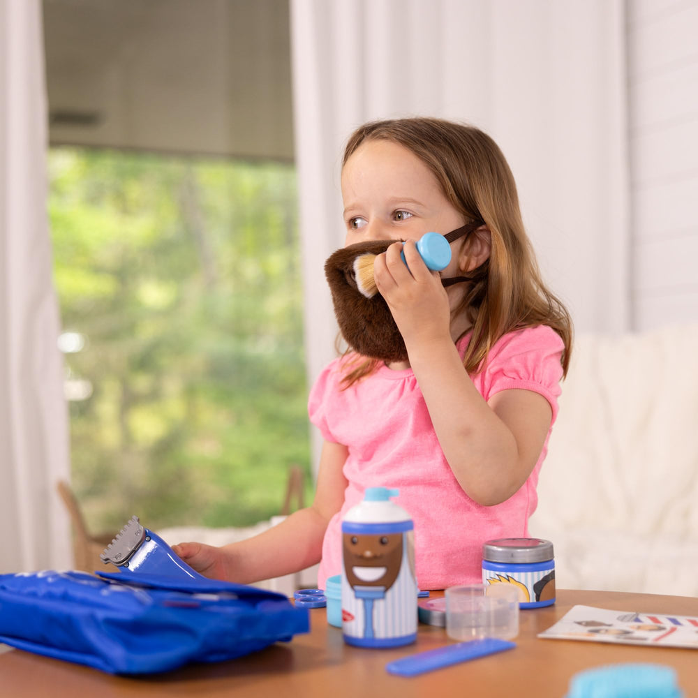 Vibrating trimmer in Melissa & Doug set provides lifelike grooming play—no batteries needed.