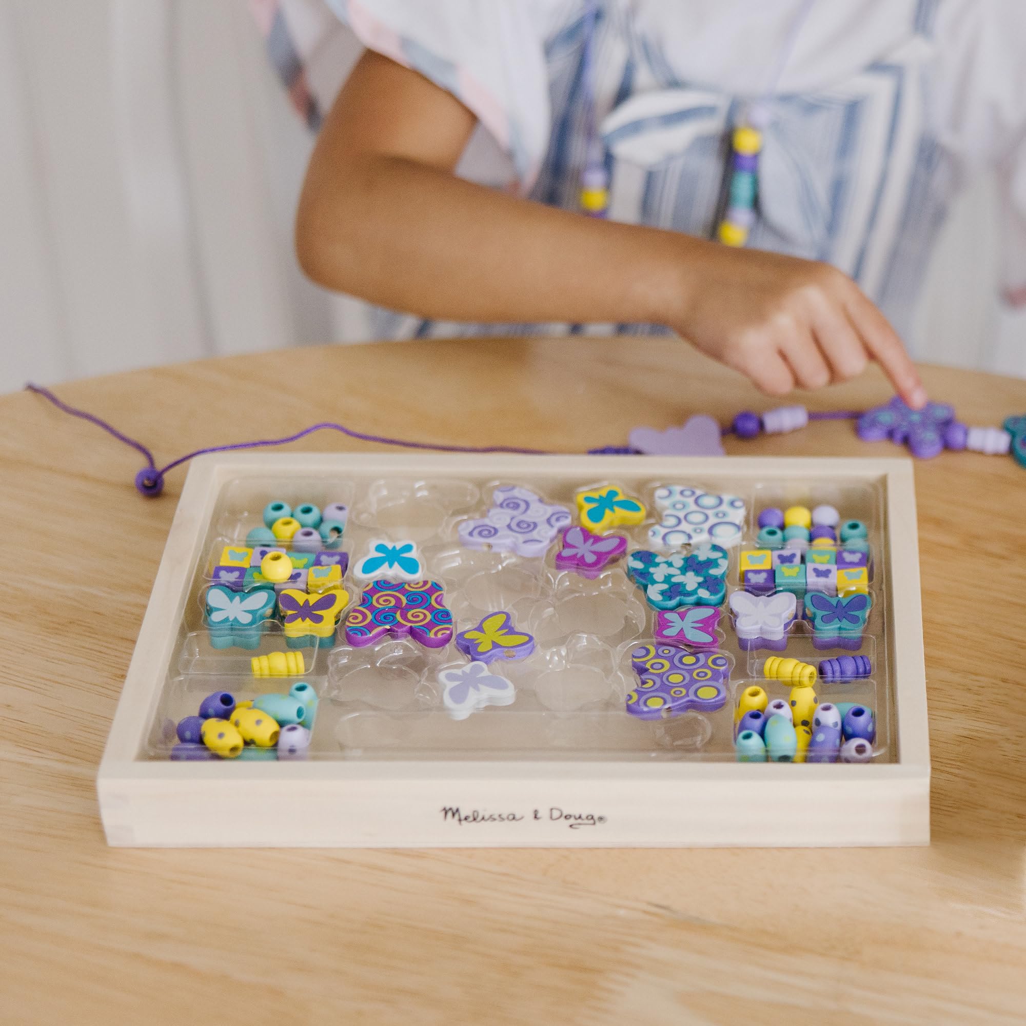 Colorful wooden butterfly beads by Melissa & Doug for creative jewelry making