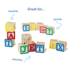 Child builds words with Melissa & Doug ABC/123 blocks.