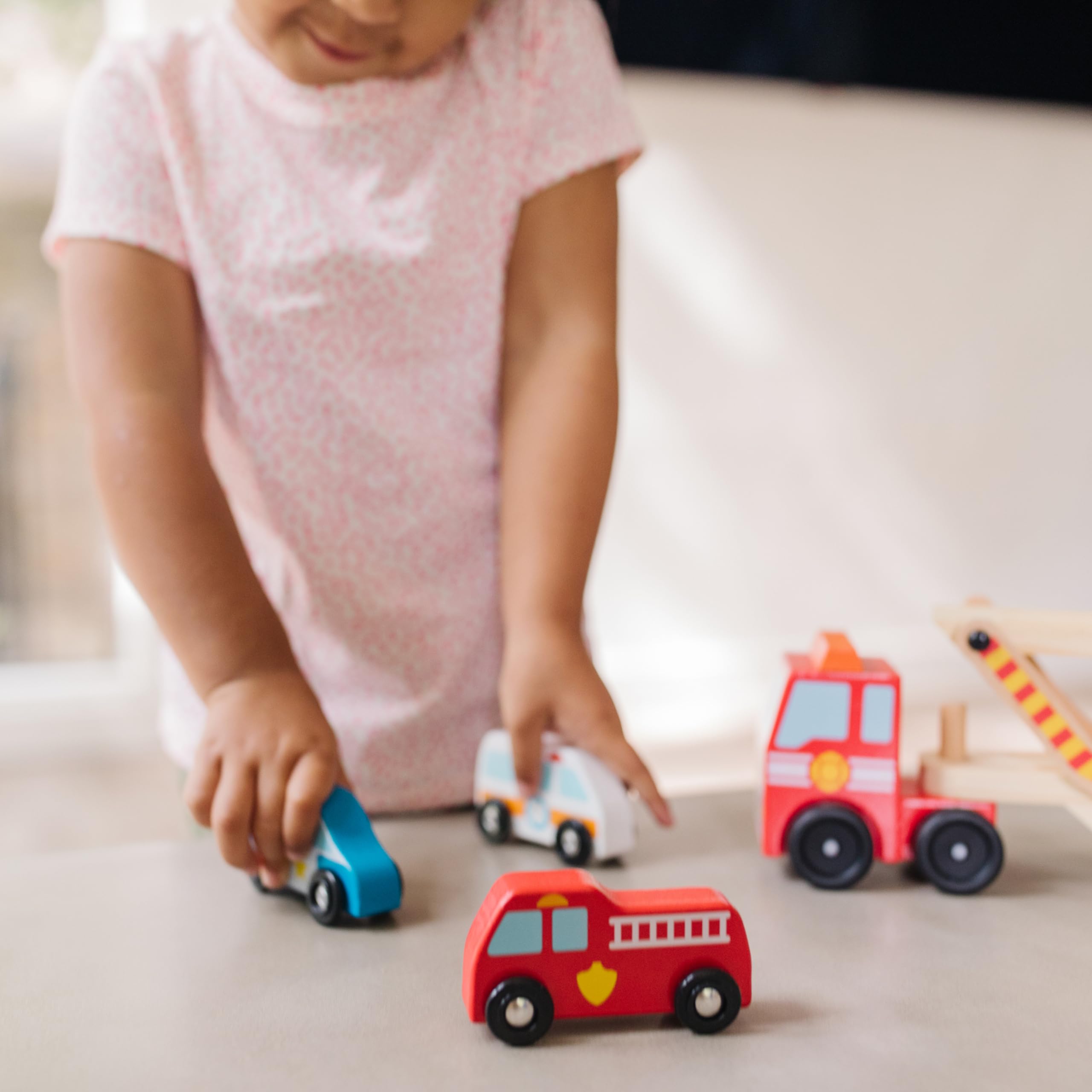 Melissa & Doug wooden construction and bright colors attract little hands.