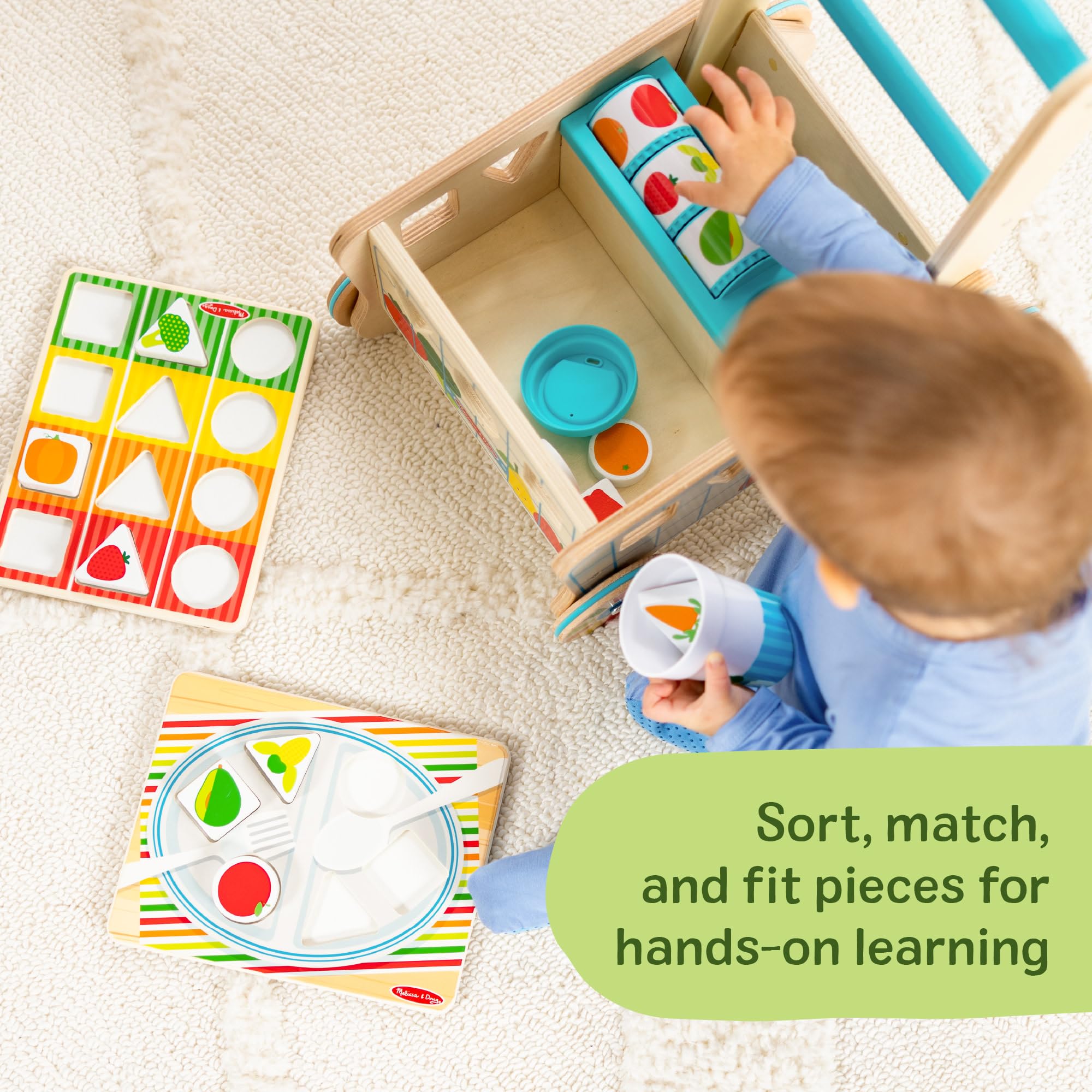 Melissa & Doug push cart supports motor skill development during pretend play.