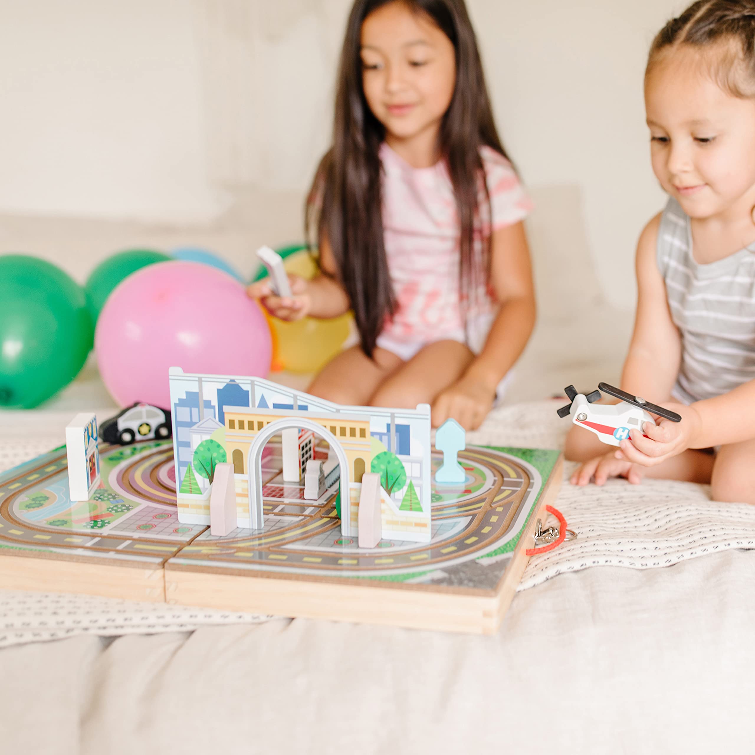 Melissa & Doug buildings, signs, and tree enrich city play.