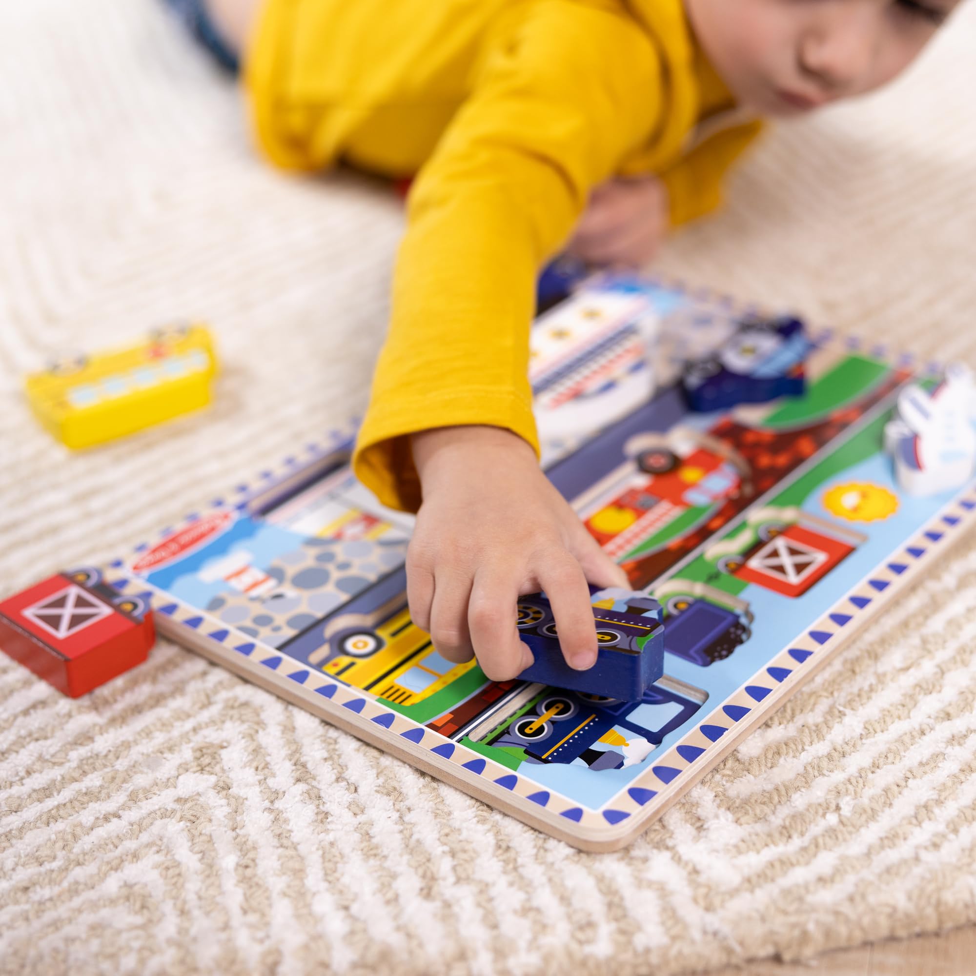 Melissa & Doug bus piece promotes coordinated hand movements during puzzle assembly