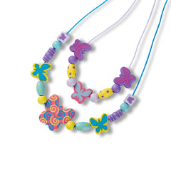 Close-up of Melissa & Doug wooden butterfly beads ready for pattern crafting