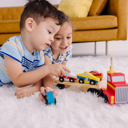 Melissa & Doug car-carrier trailer with four magnet cars for imaginative deliveries