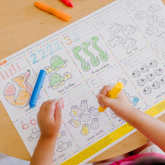 Crayons slide up and down in protective holders for tidy storage.