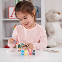 Kids painting the Melissa & Doug Monster Truck expresses creativity during a fun, screen-free activity.