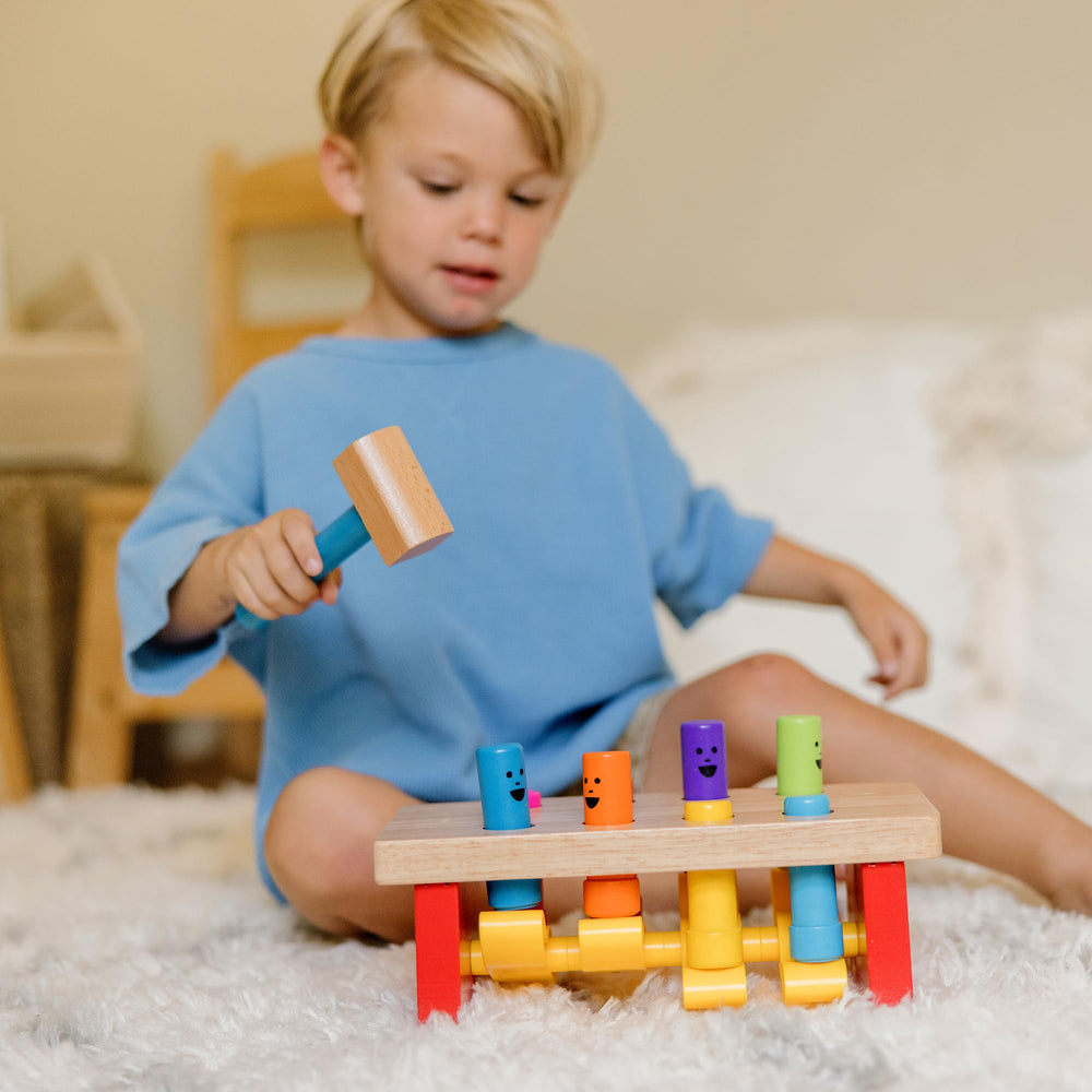 Melissa & Doug Deluxe Pounding Bench includes wooden mallet for safe pounding sessions