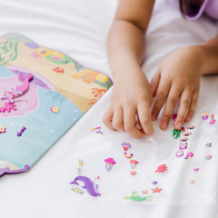 Melissa & Doug foldable background with die-cut handle supports on-the-go play.