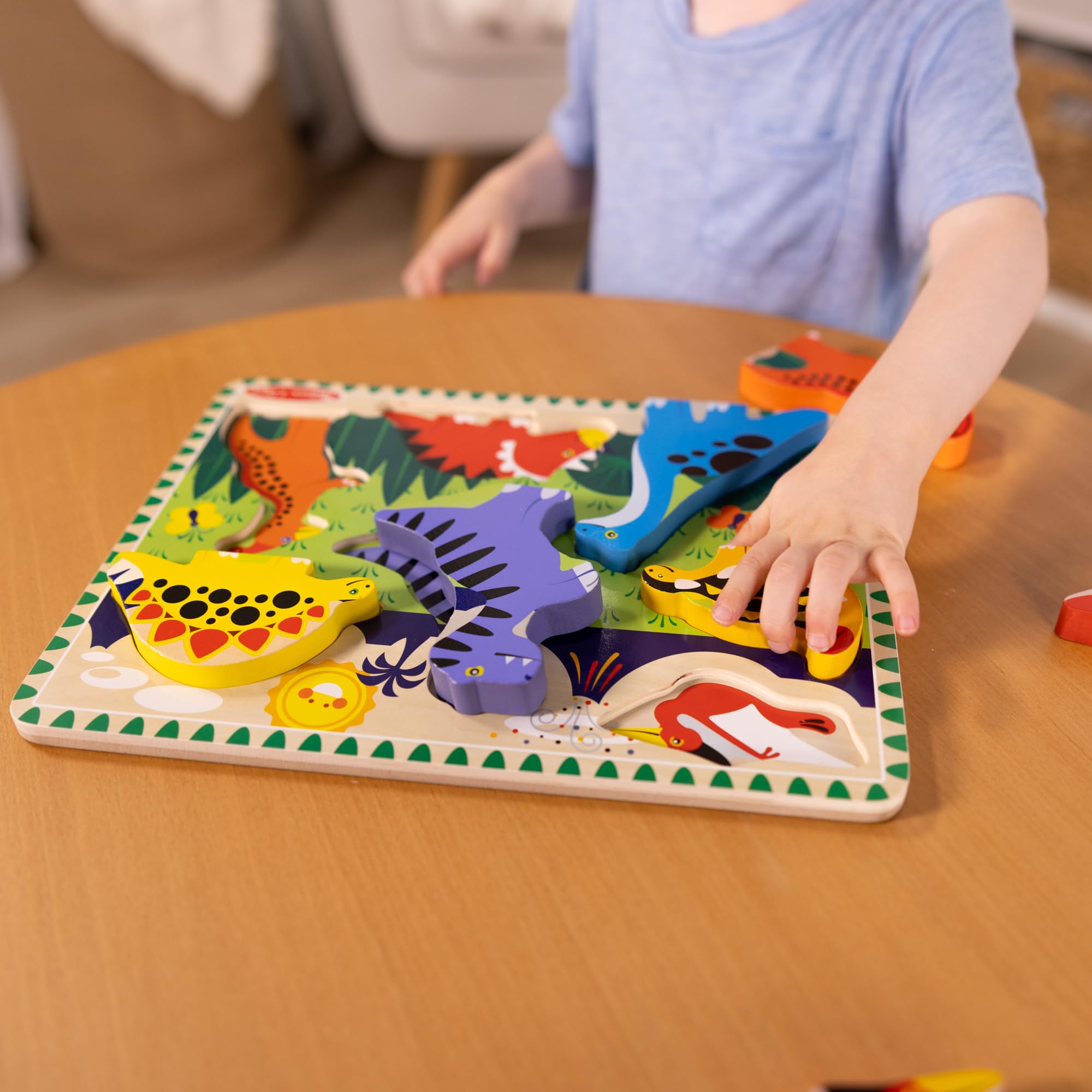 Chunky Melissa & Doug dinosaur puzzle pieces aid fine motor practice