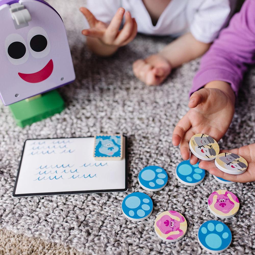 Melissa & Doug envelopes and invitations support mail-time role-play.