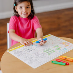 Erasable crayons on learning mats support mess-free practice and repeatable drawing.