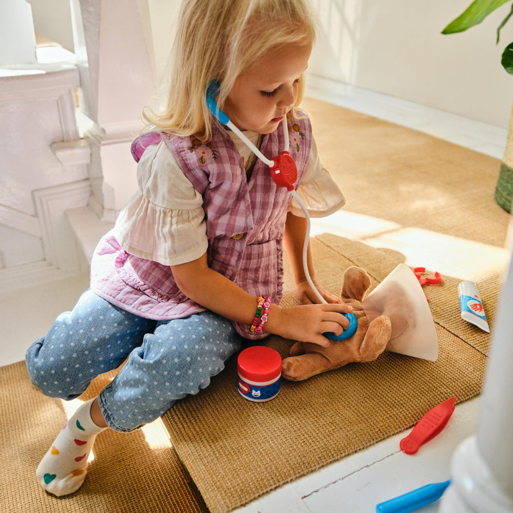 Melissa & Doug plush dog for compassionate pretend care