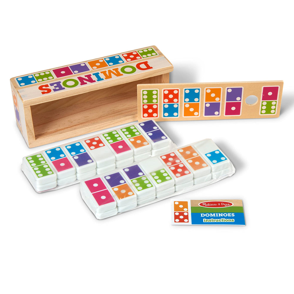 Melissa & Doug family playing dominoes around a table captures shared fun