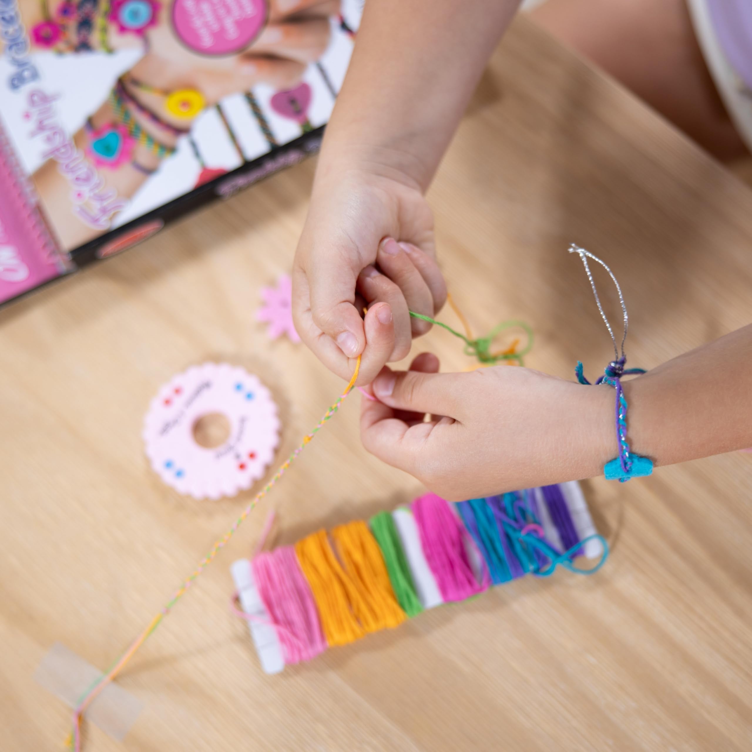Melissa & Doug On the Go felt charms add playful embellishments.