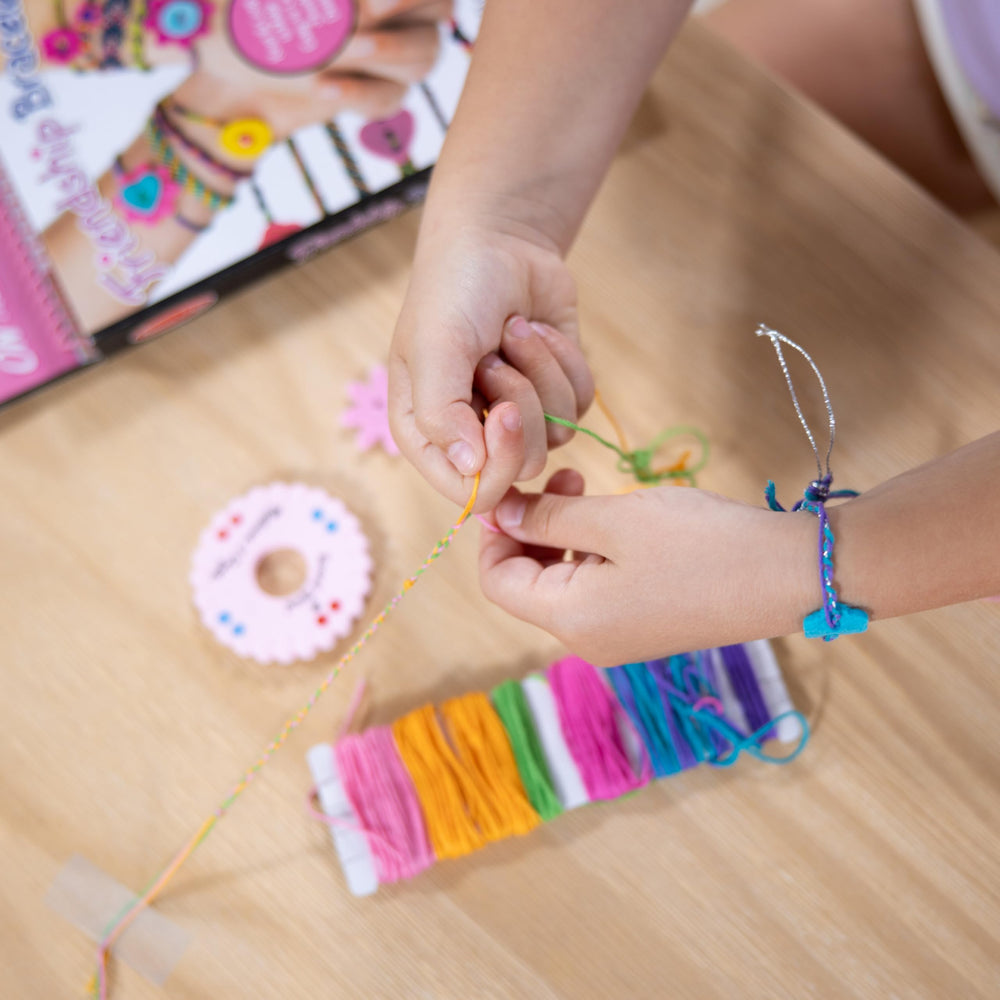 Melissa & Doug On the Go felt charms add playful embellishments.
