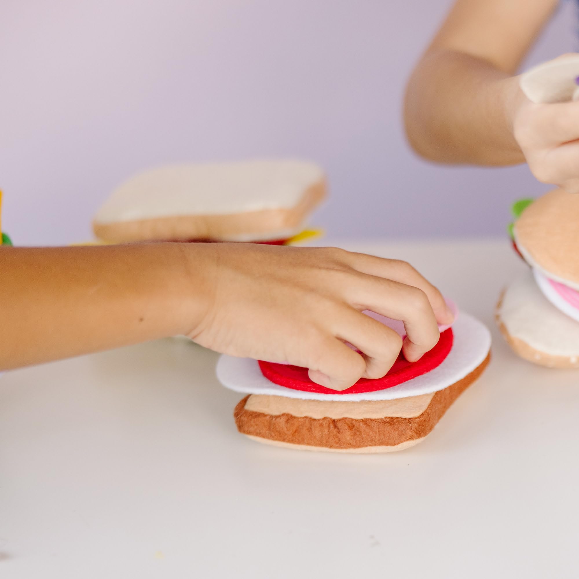 Melissa & Doug felt pita pocket for easy sandwich exploration.