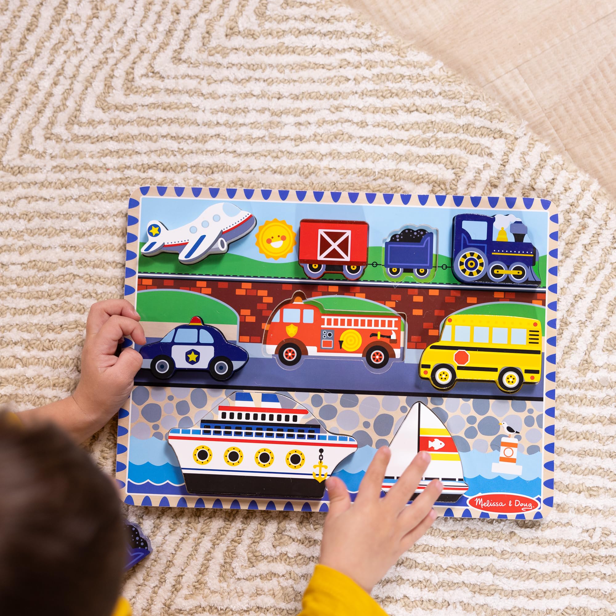 Melissa & Doug fire truck piece supports fine motor practice through grasp-and-place play