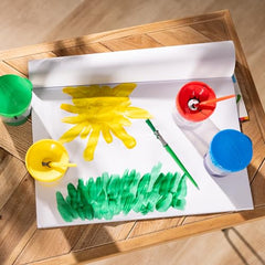 Melissa and Doug durable double-sided paper reduces mess during painting sessions.