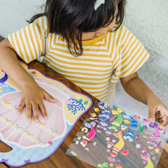 Melissa & Doug glittery mermaid wardrobe adds eye-catching customization.