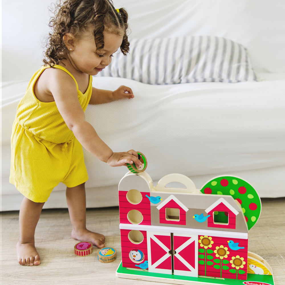 Melissa & Doug GO Tots silo and sliding doors enabling dynamic motion