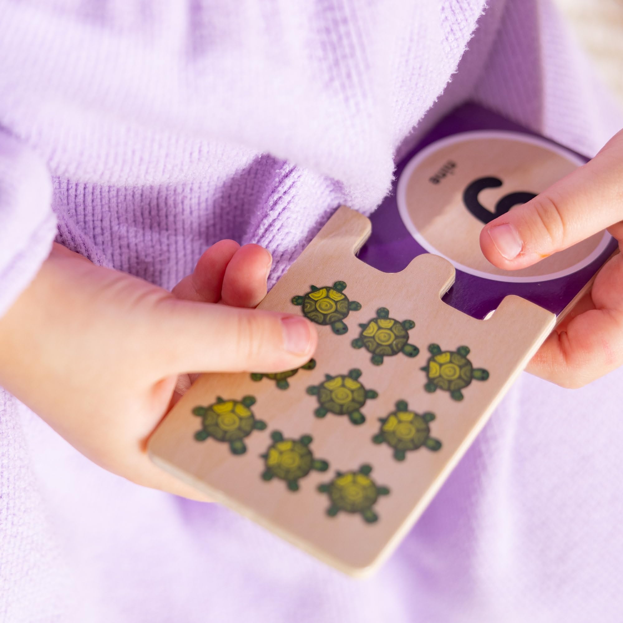 Independent play with Melissa & Doug number puzzles to build confidence
