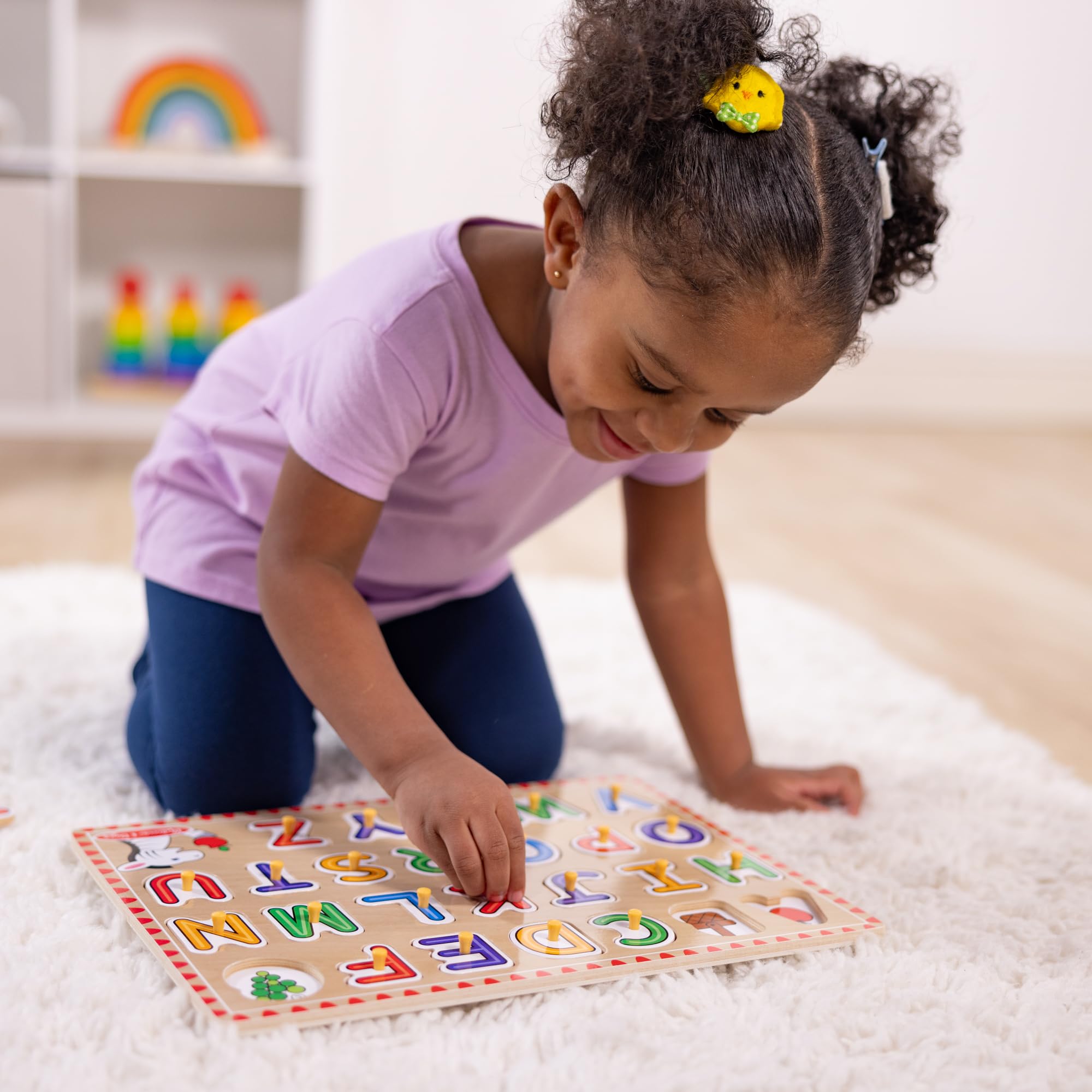 Colorful pictures underneath letters support letter-sound associations.