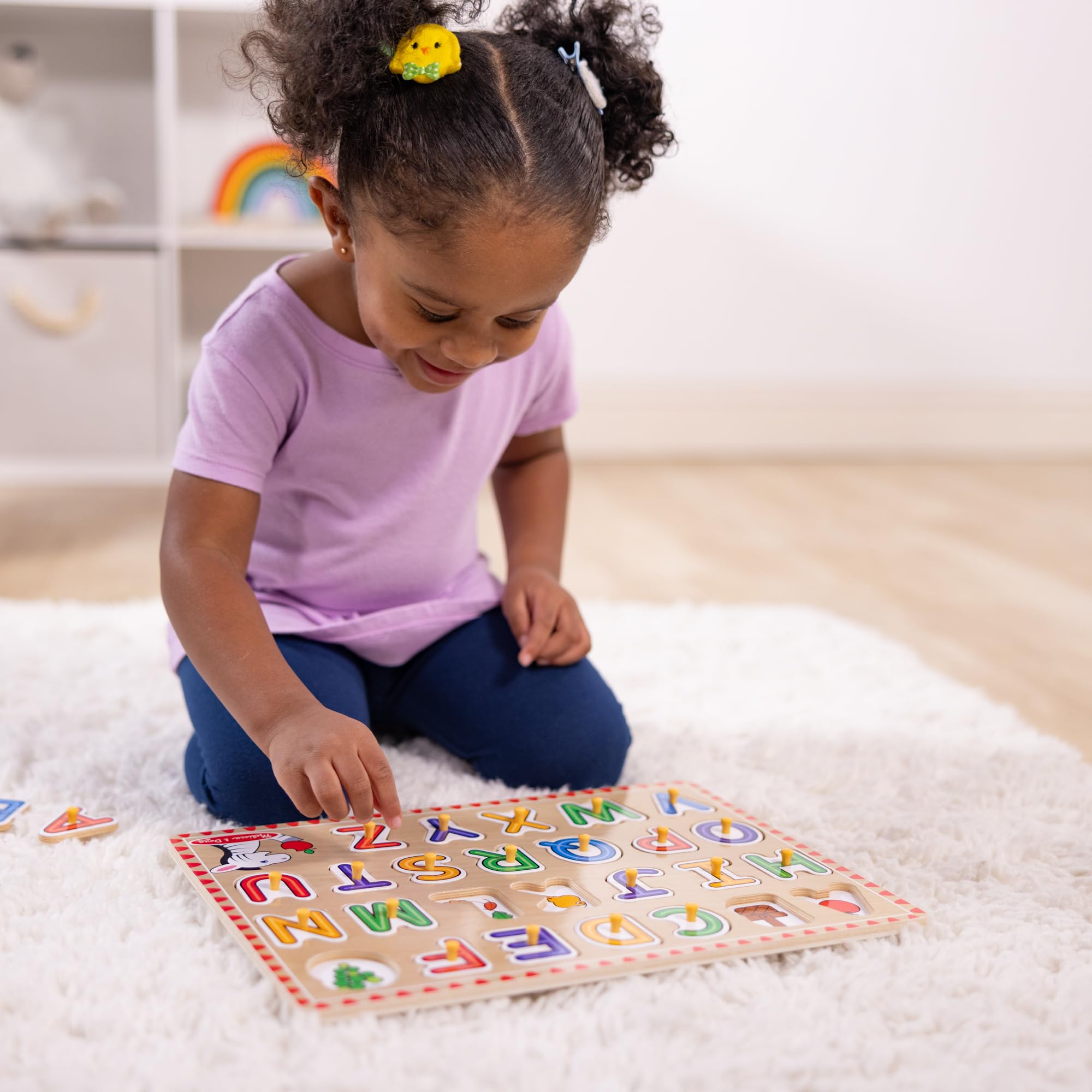 Melissa & Doug Lift & See shows letters with pictures to spark recognition.