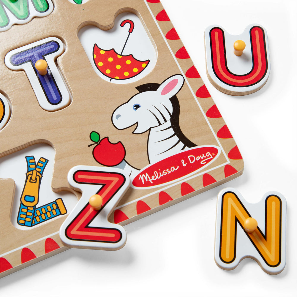 Letters align on the wooden board for hands-on matching.