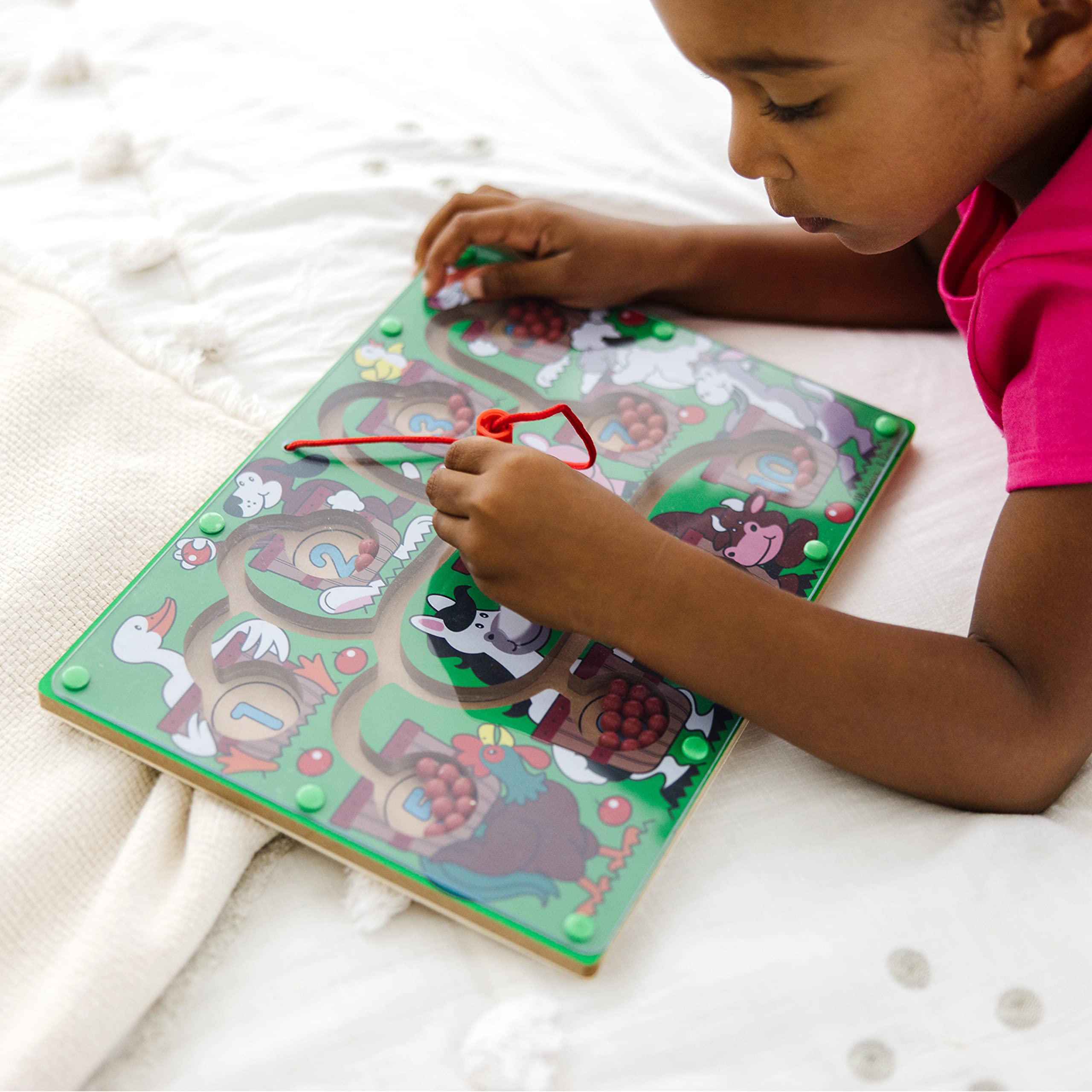 Melissa and Doug Magnetic Wand Number Maze enhances hand-eye coordination through active play.