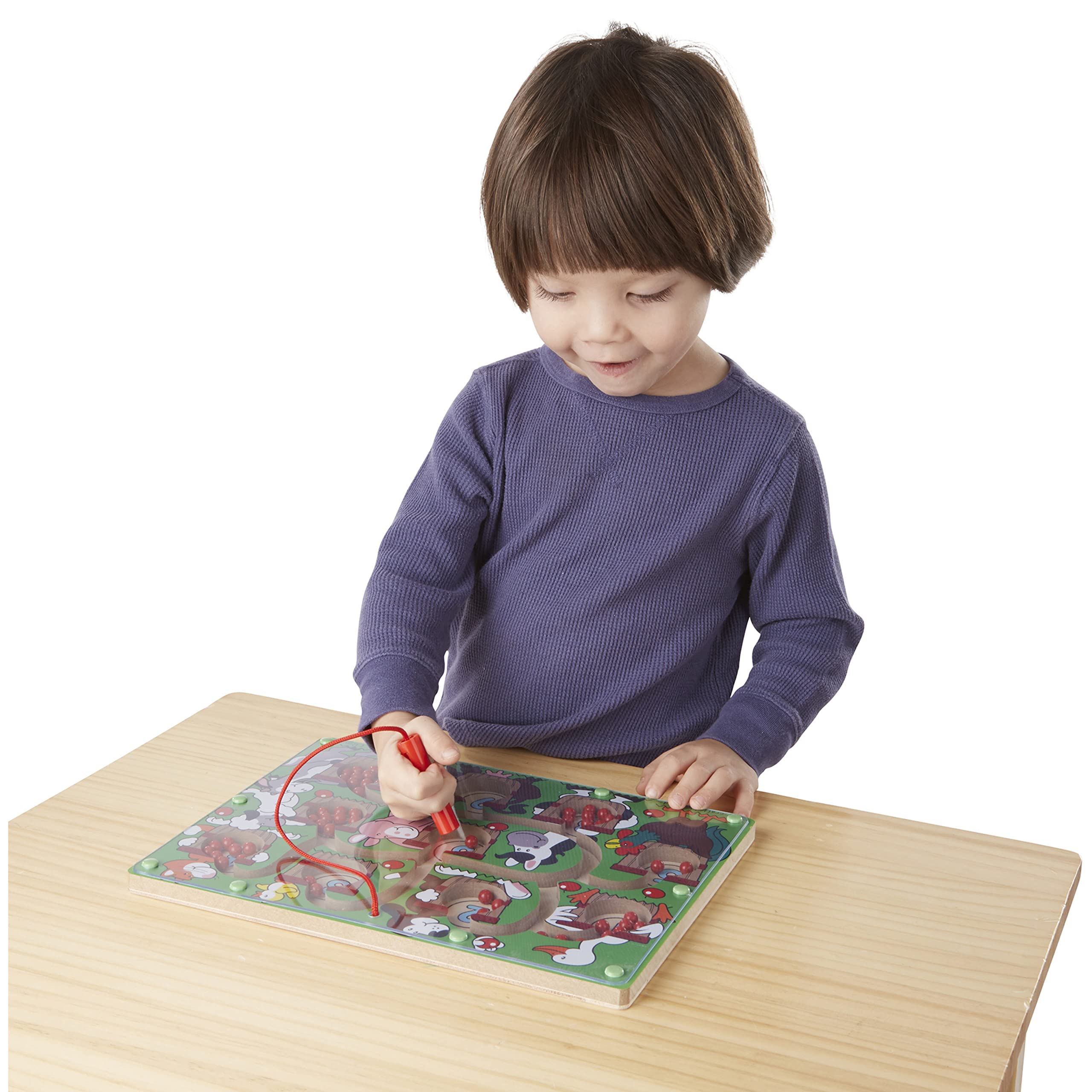 Melissa and Doug Magnetic Wand Number Maze wand attached to sturdy board during play.