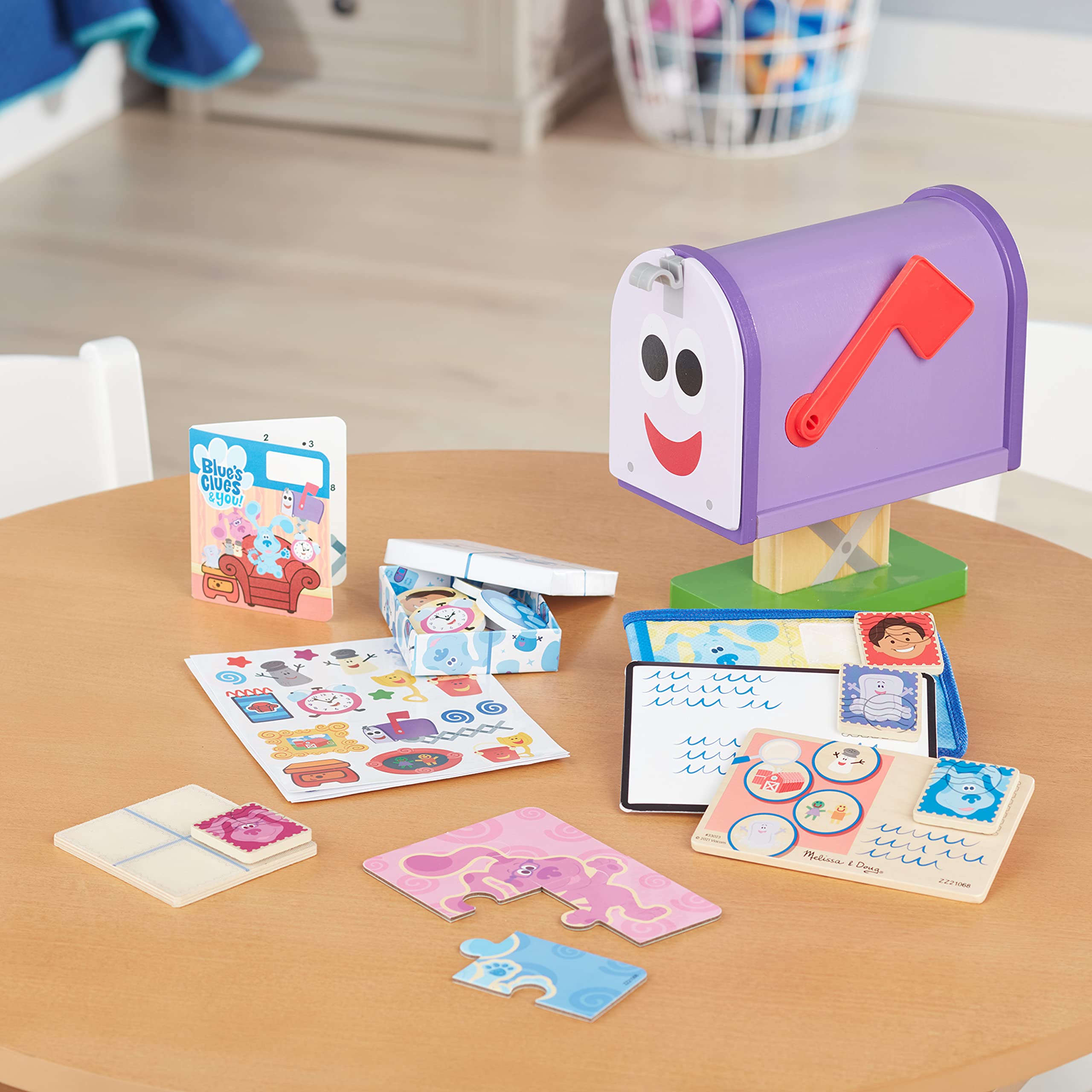 Melissa & Doug mailbox storage keeps all pieces organized inside.
