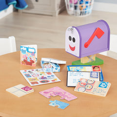 Melissa & Doug mailbox storage keeps all pieces organized inside.