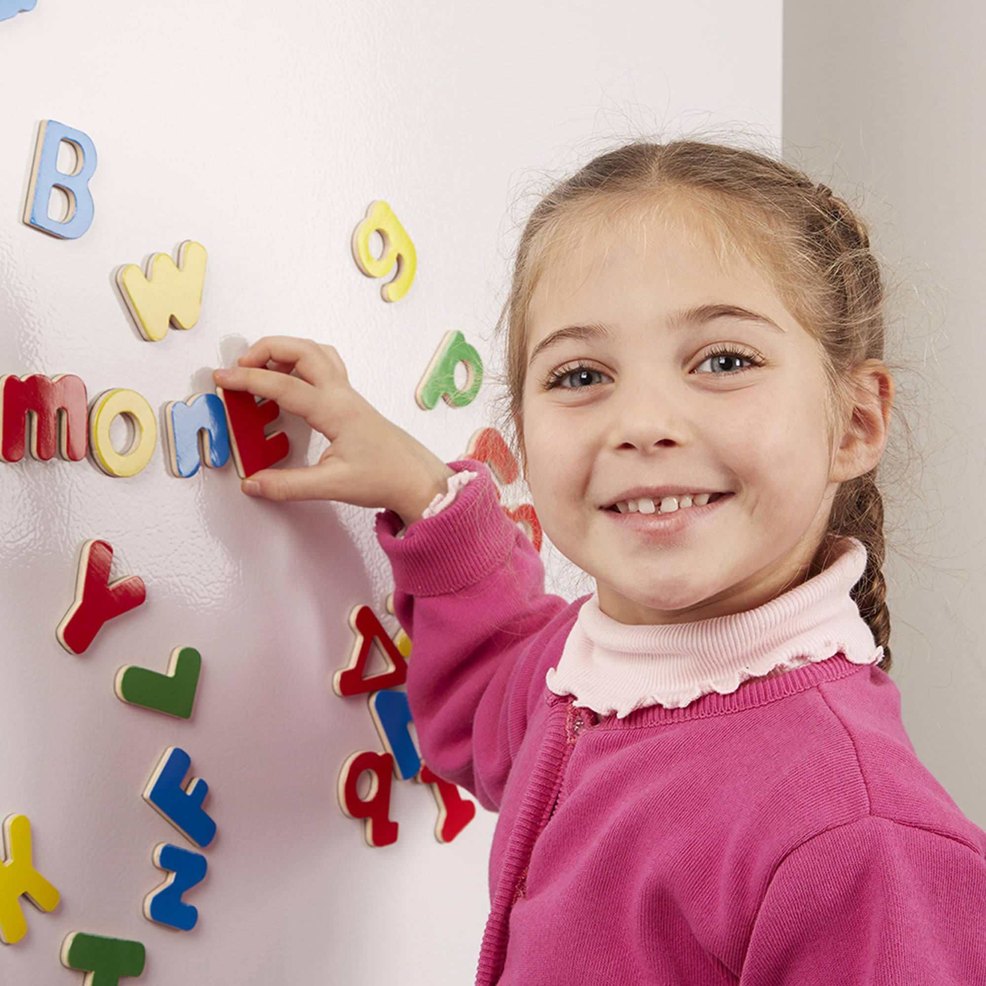 Montessori inspired alphabet magnets supporting fine motor skills and early literacy.