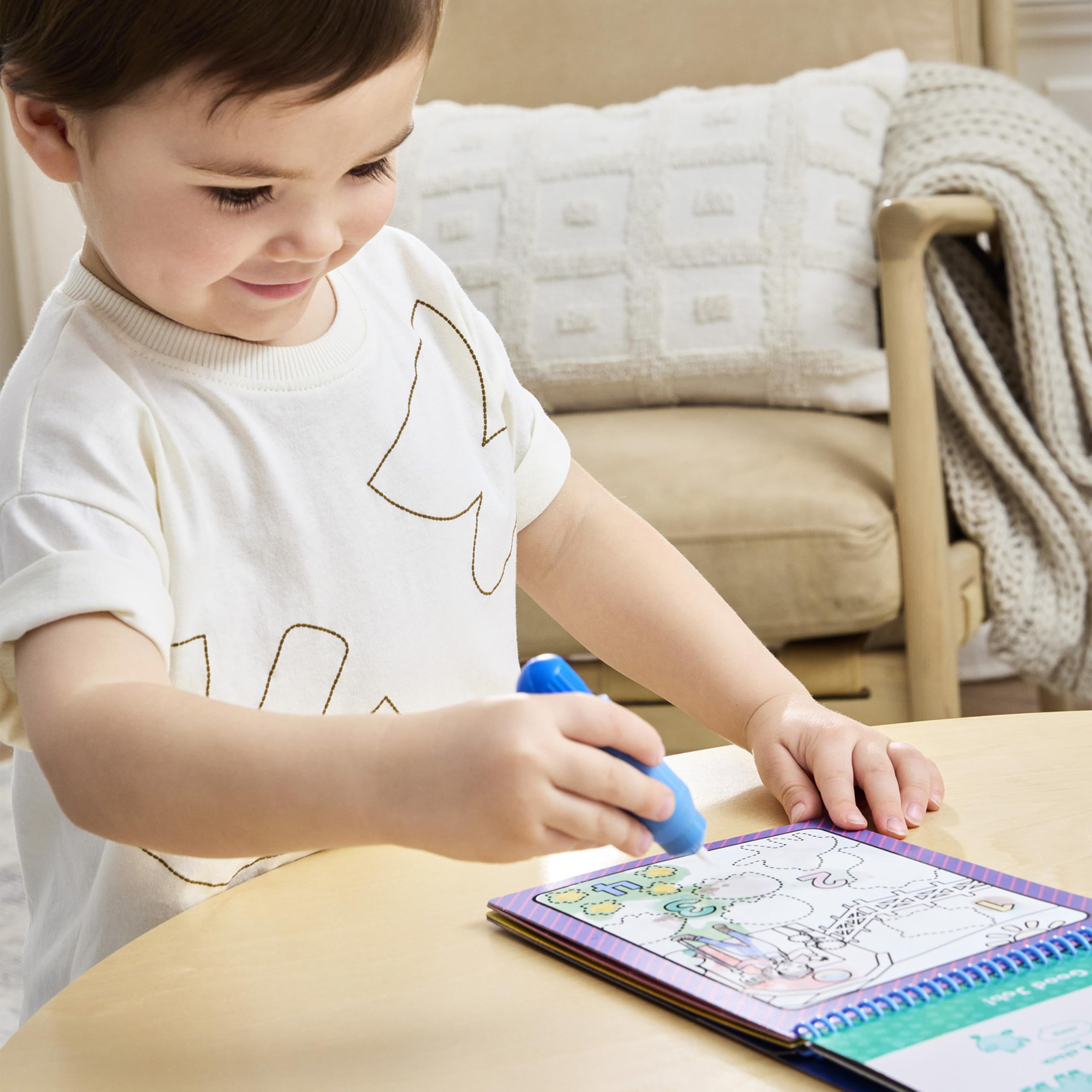 Travel-friendly Water Wow pad with built-in water pen for on-the-go learning