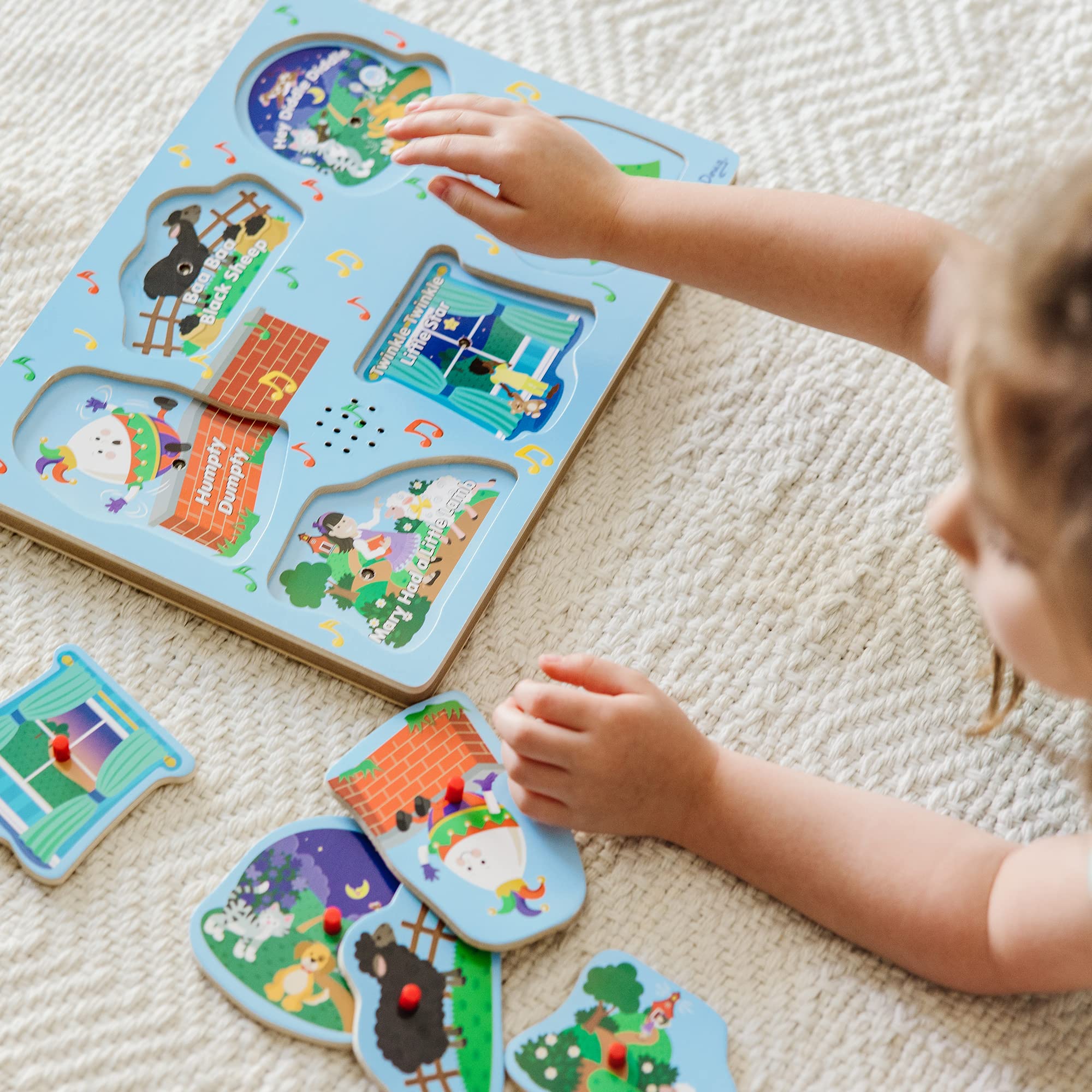 Melissa & Doug Nursery Rhymes 2 puzzle in use promotes focus and repeated practice.