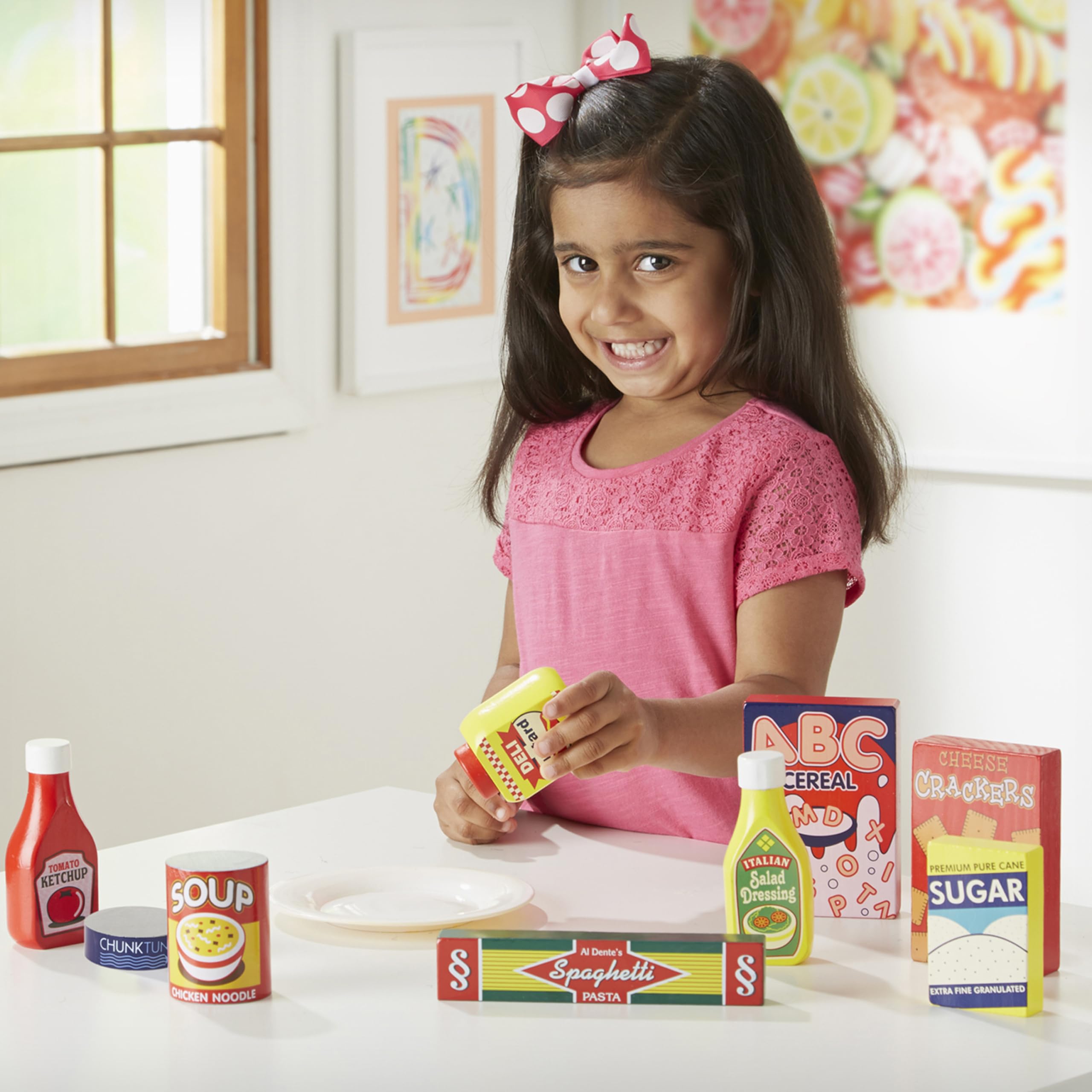 Melissa & Doug wooden ketchup toy for creative meal-time pretend play.
