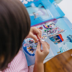 Built-in storage keeps all pieces organized during adventures with Melissa & Doug.