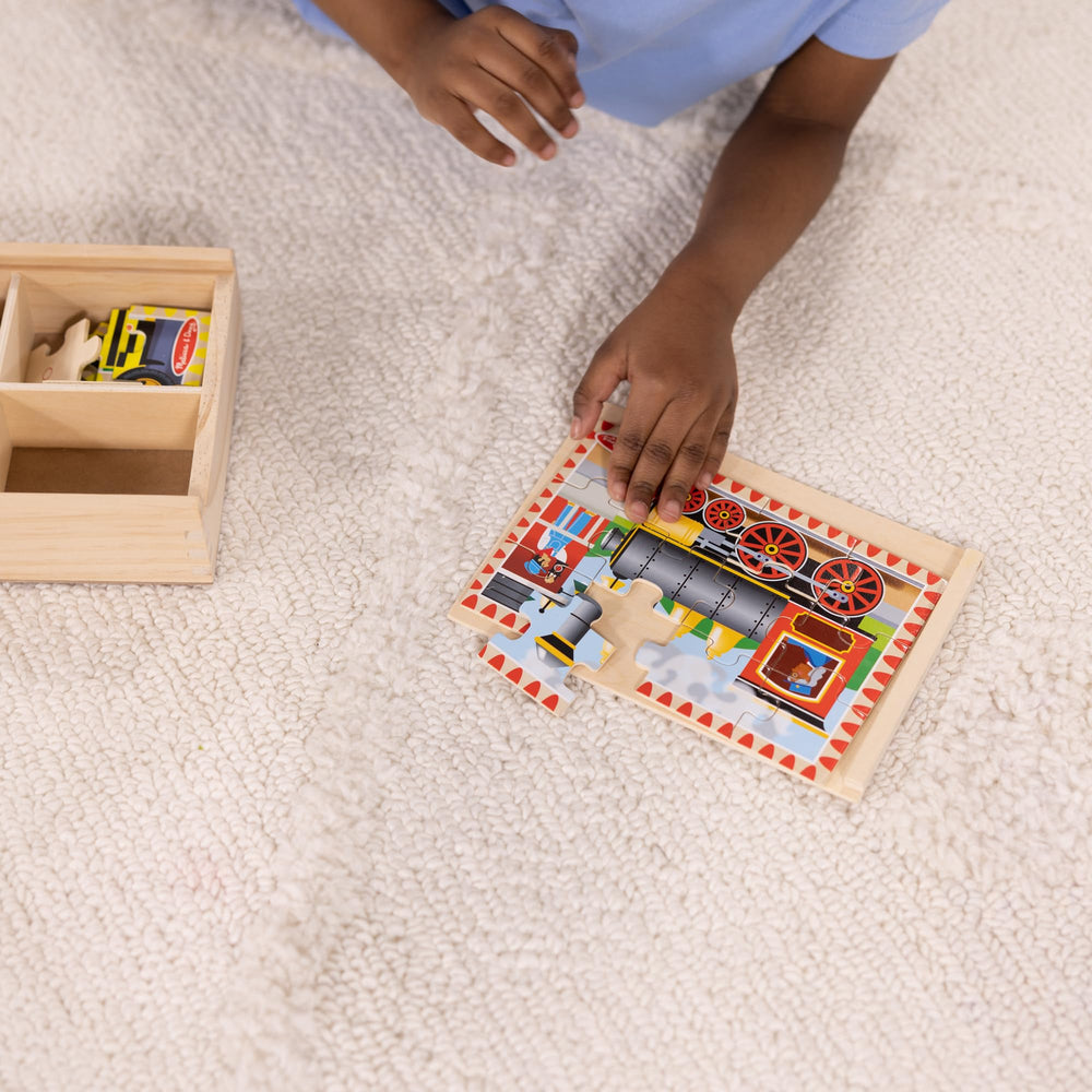Melissa & Doug puzzle pieces neatly stored in a four-compartment box for cleanup.
