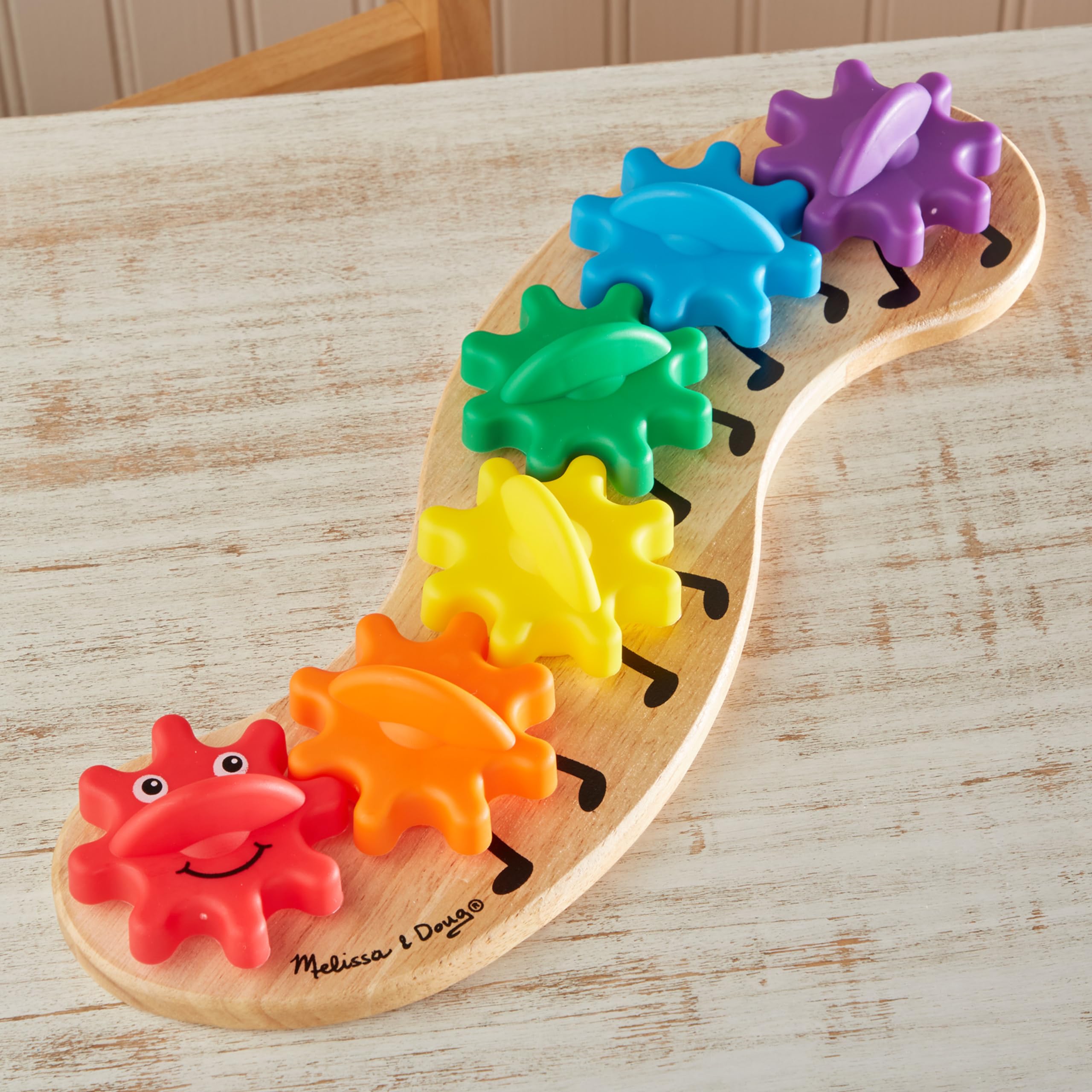 Education-focused play with Rainbow Caterpillar gears teaching colors