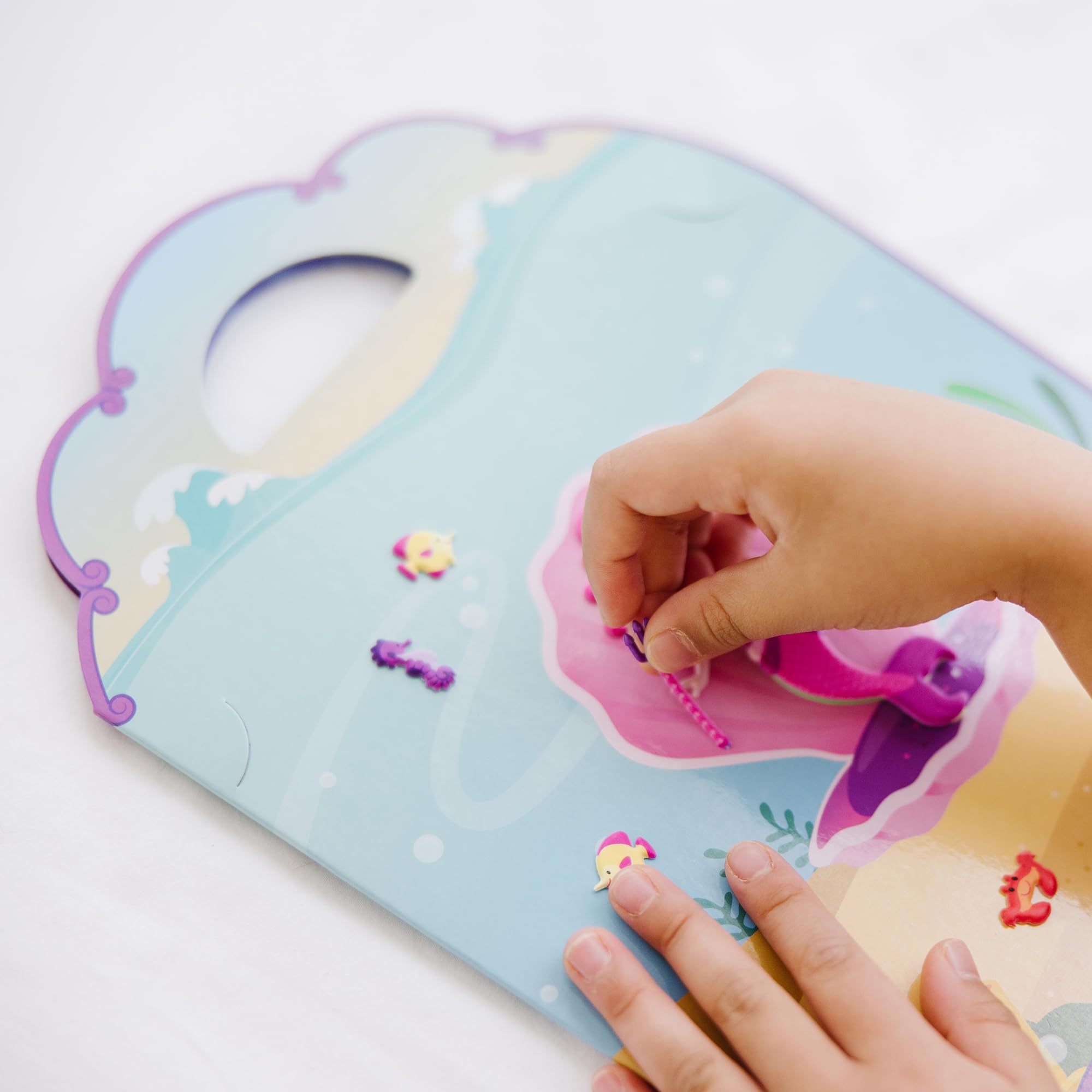 Melissa & Doug restickable stickers offer easy rearranging during play.