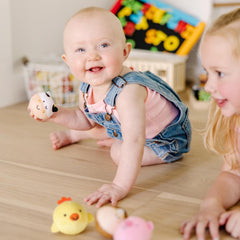 Melissa & Doug Rollables Farm Friends child holding demonstrates easy grasp.