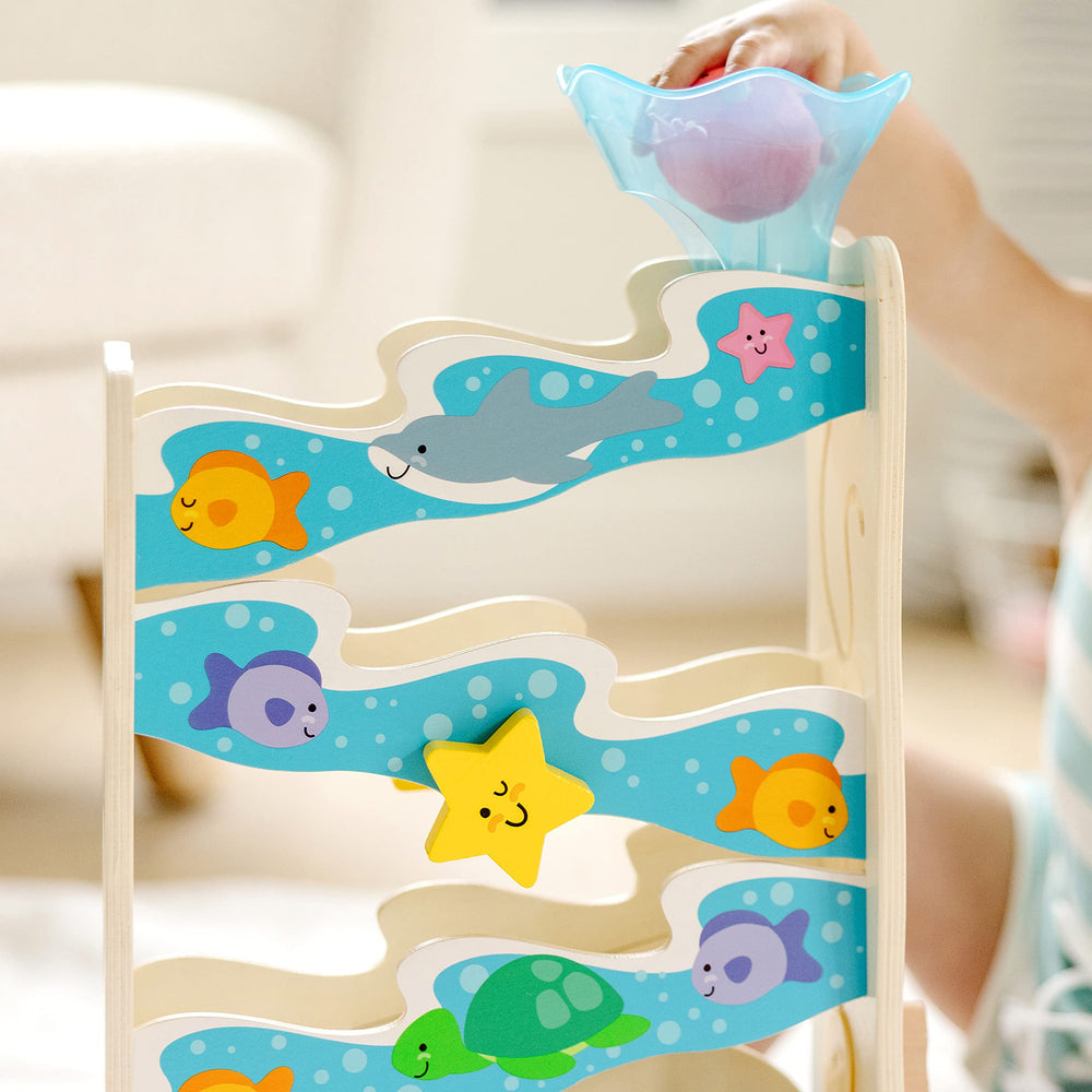 Melissa & Doug Rollables Ocean Slide octopus rollable with chime enhances auditory feedback.