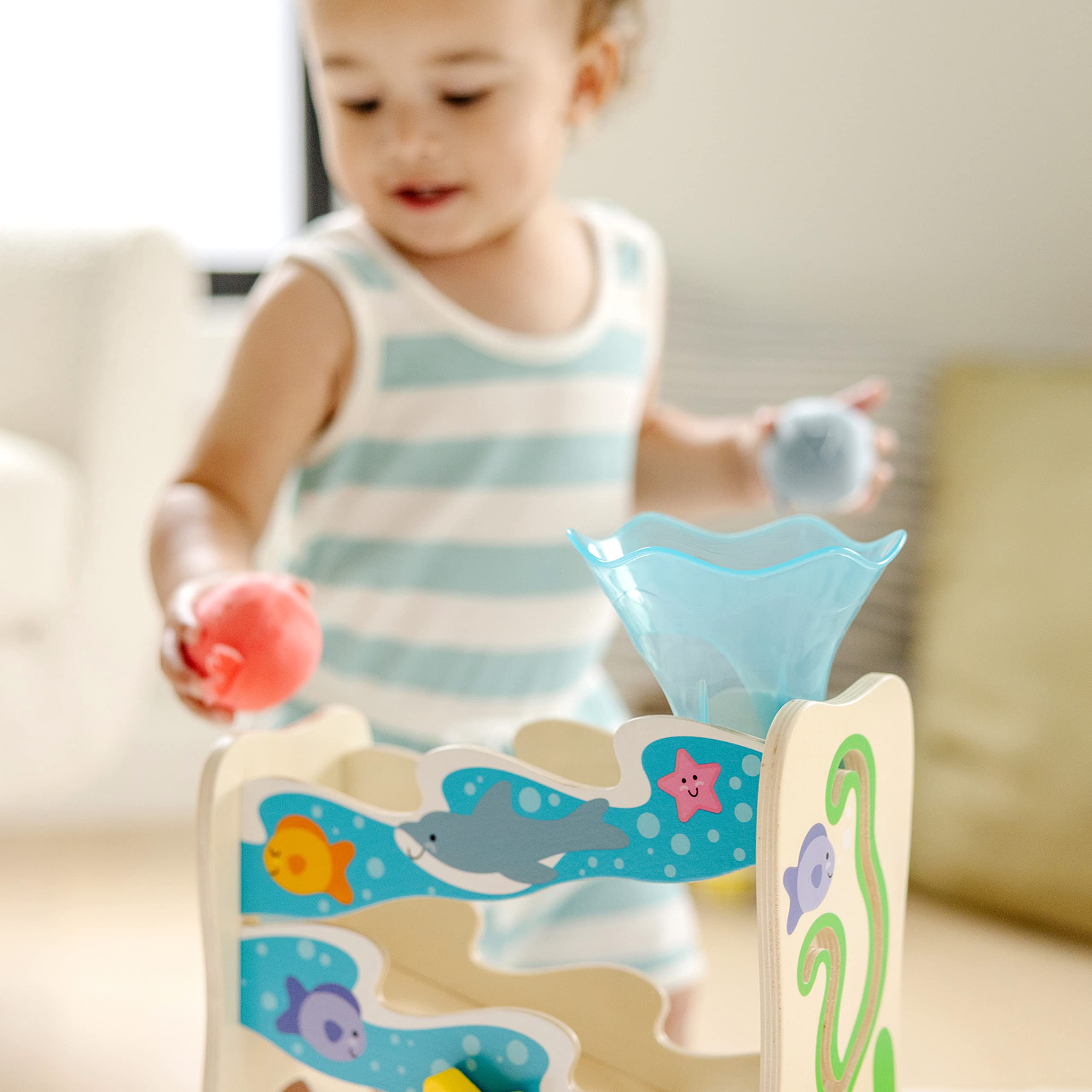 Melissa & Doug Rollables Ocean Slide removable funnel enables versatile play.